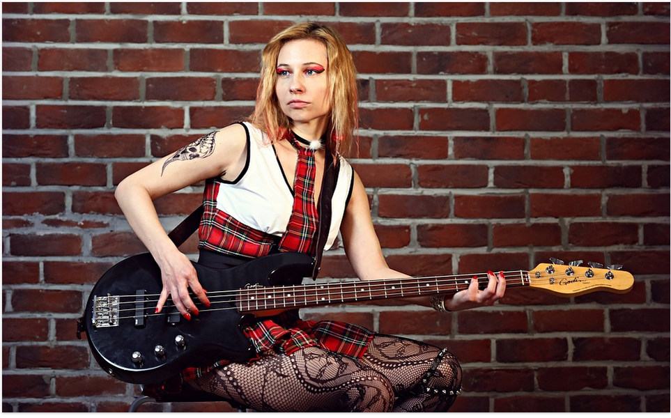 a lady with a bass guitar